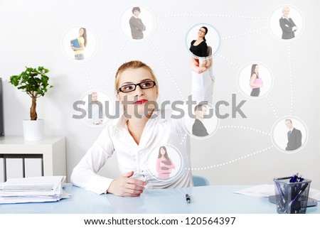 Businesswoman choosing the right worker of all applicants on an abstract button.