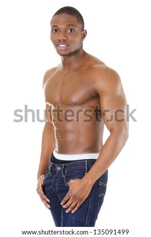 Happy well-built muscular black man in jeans, isolated on white