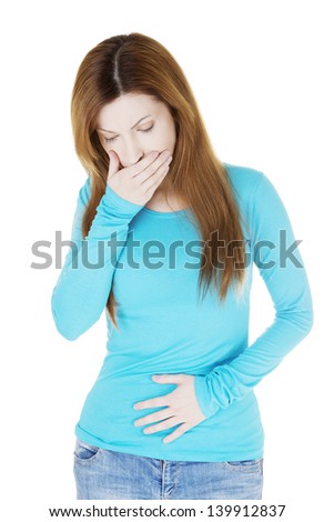 Woman with strong pain of stomach and nausea , isolated on white