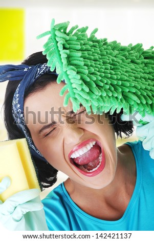 Tired and exhausted cleaning woman screaming