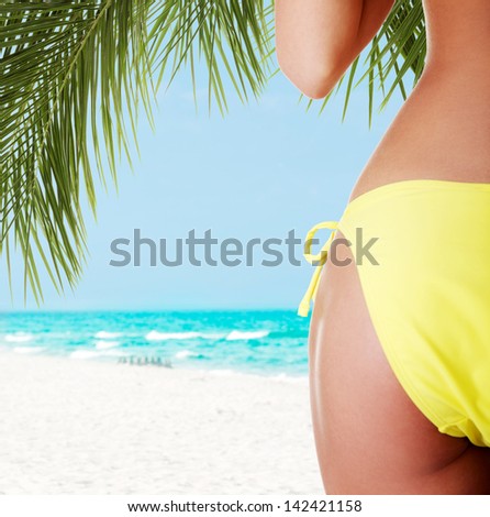 Sexy buttocks of young fit woman with soft and clean skin, in bikini