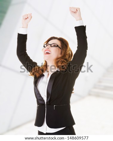 Success, winner businesswoman with fists up