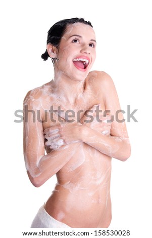 Young fit woman in shower washing her perfect fit body