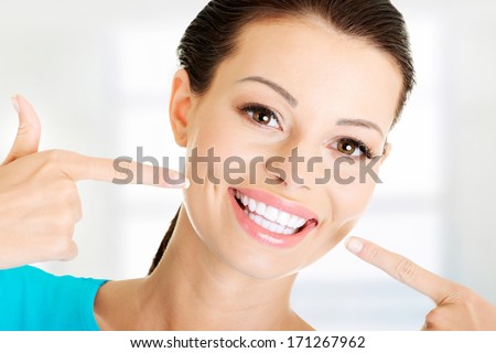 Woman Showing Her Perfect Straight White Teeth.