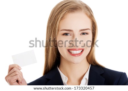 Beautiful caucasian business woman holding personal card. Isolated on white.