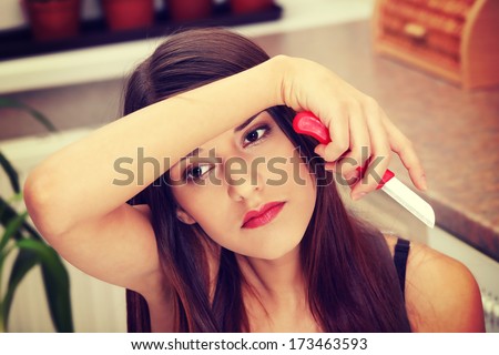 Young tired woman peeling something