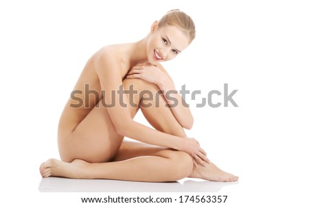 Beautiful caucasian naked woman sitting with fresh clean skin Isolated on white Beautiful caucasian naked woman sitting with fresh clean skin Isolated on white