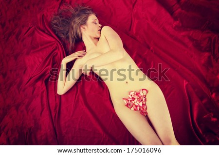 Beautiful body of woman with petals of roses
