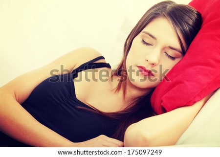 Young woman\'s sleeping on couch. In home.
