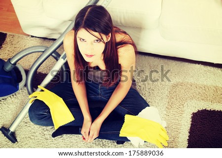 Young woman hates cleaning home.