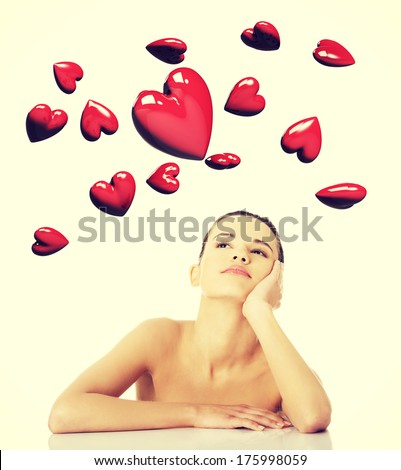 Young woman dreaming about big love