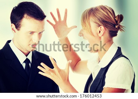 Two work colleagues arguing (male and female)