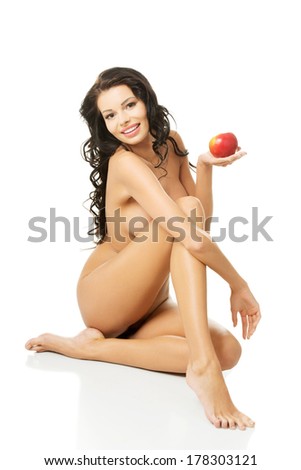 Happy fit nude woman with apple, isolated on white. Healthy life, siet and nutrition concept.