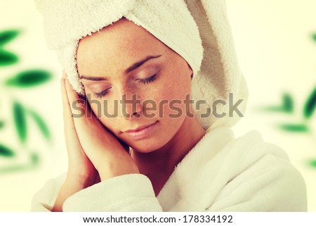 Portrait of 20-25 years old beautiful woman wearing bathrobe