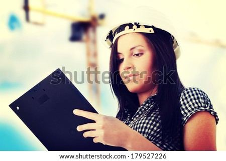Engineer woman in white helmet
