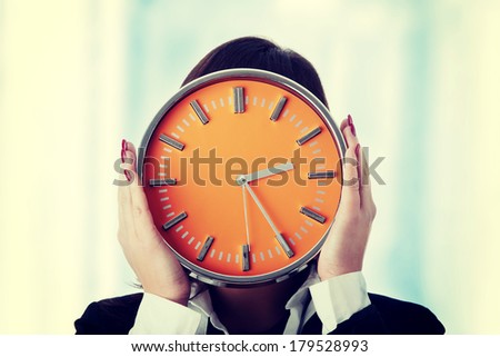 Businesswoman with clock - time concept