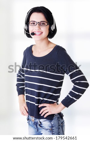 Closeup of attractive customer support representative smiling with headset