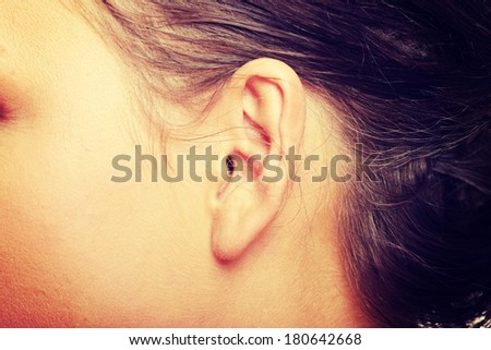 A close-up portrait of a female ear