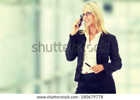 Attractive young business women calling by cellular phone