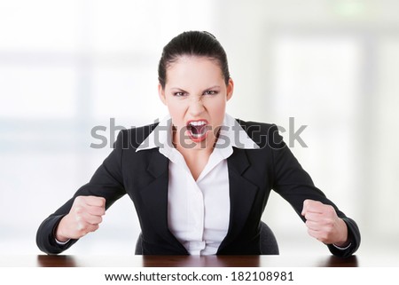 Stressed or angry businesswoman screaming loud