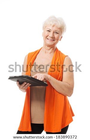 An old lady with tablet. Isolated on white.