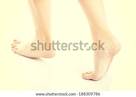 Woman\'s fresh clean feet with pedicure. Isolated on white.