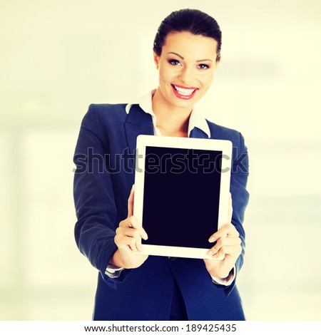 Business woman showing tablet PC with touch pad.