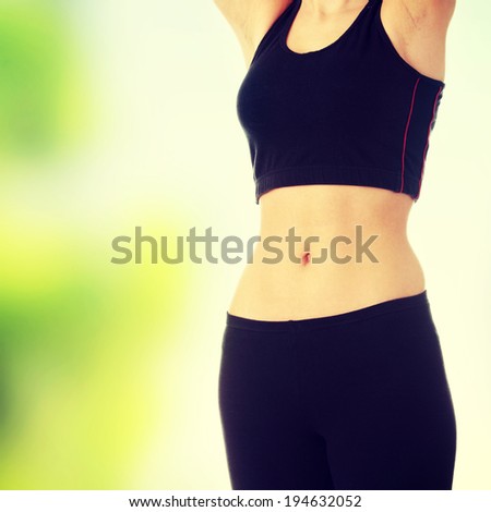 Beautiful fit belly of young woman