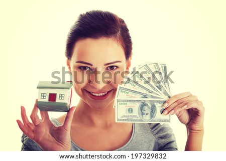 Young beautiful woman with money and house
