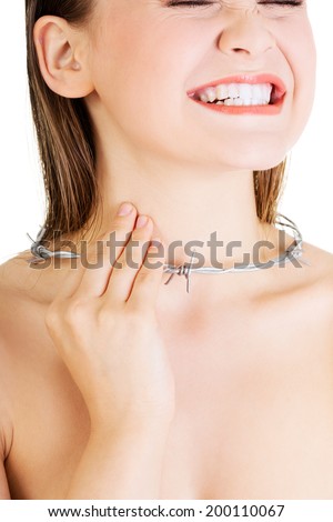 Throat pain concept. Young woman with barbed wire around her throat. Isolated on white