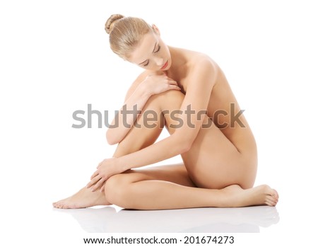 Beautiful caucasian naked woman sitting with fresh clean skin Isolated on white Beautiful caucasian naked woman sitting with fresh clean skin Isolated on white