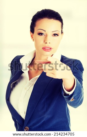 Young beautiful caucasian business woman pointing on you ,isolated on white