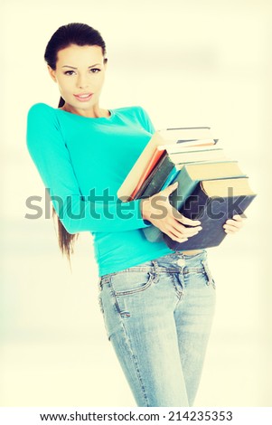 Student woman holding heavy books, isolated on white
