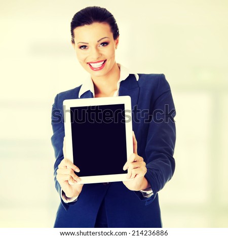 Business woman showing tablet PC with touch pad. Isolated on white