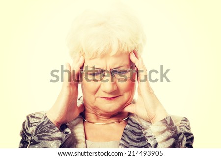 An old elegant lady is having a headache. Isolated on white.