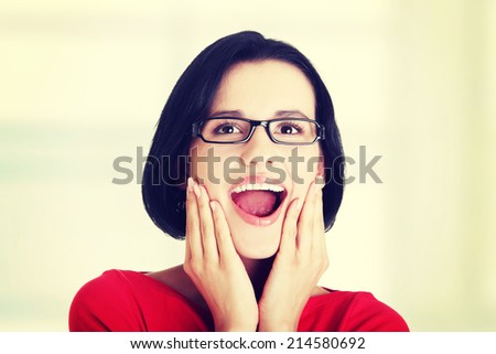 Shocked and excited woman looking up, isolated on white