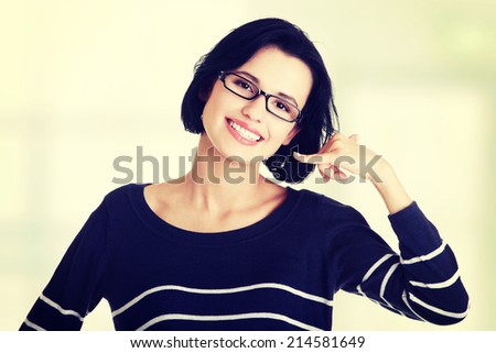 Young happy woman gesturing \