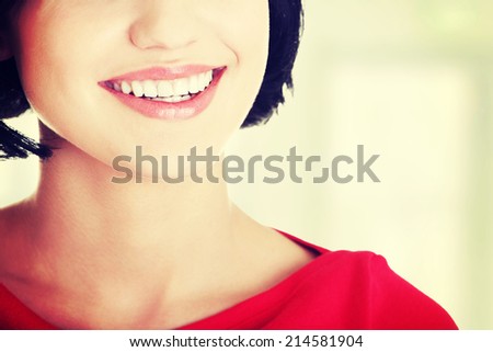 Beautiful woman with  her perfect straight white teeth.