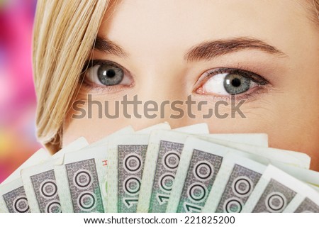 Woman with polish money in hand