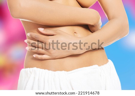Sexy, flat femal belly. She touching her belly.