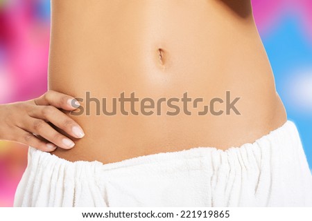 Fit and slim young woman belly