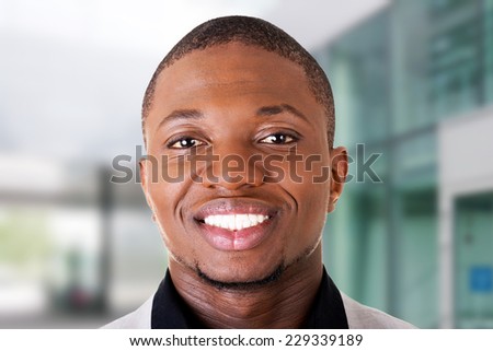 Handsome black male businessman smiling toothy