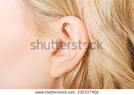 Close up on female ear.