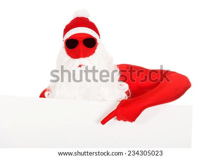 Portrait of santa in latex clothes showing empty banner.