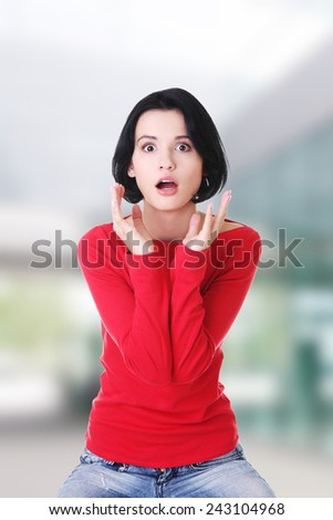 Stressed and shocked woman is going crazy in frustration.