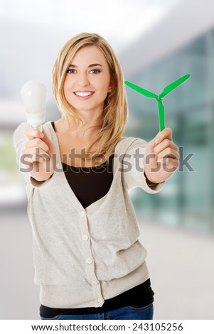 Woman with led light bulb and windmill.
