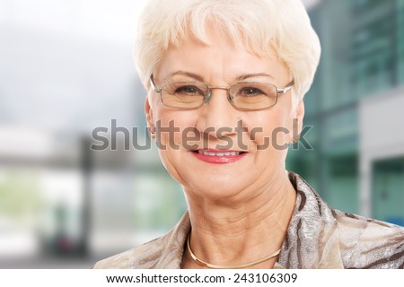 Portrait of an old lady in eyeglasses