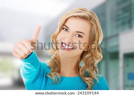 Happy smiling woman with ok hand sign