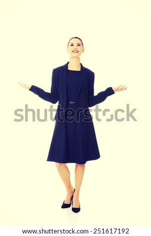Business woman showing something or copyspase for product or sign text