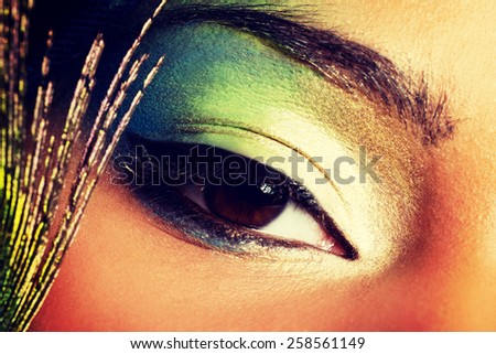 Beauty woman with artistic eye make up.